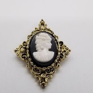 gold tone cameo filigree brooch black